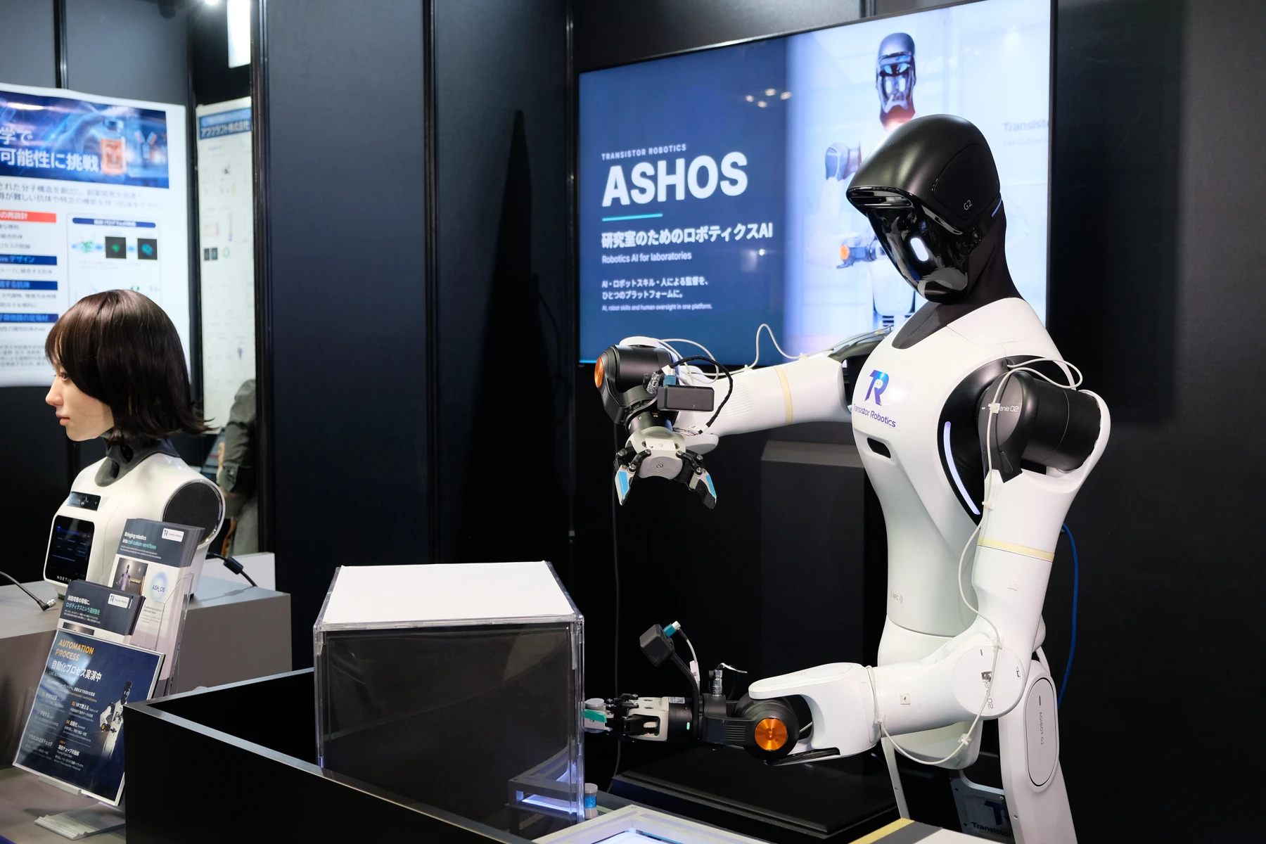 Transistor Robotics demonstration setup with a humanoid robot and laboratory equipment